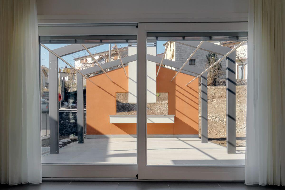 white sliding door offering space and structural support to a room