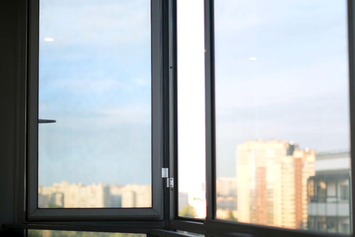 an opened aluminum window in an office